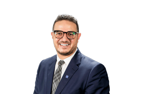 a man wearing a suit with a glasses